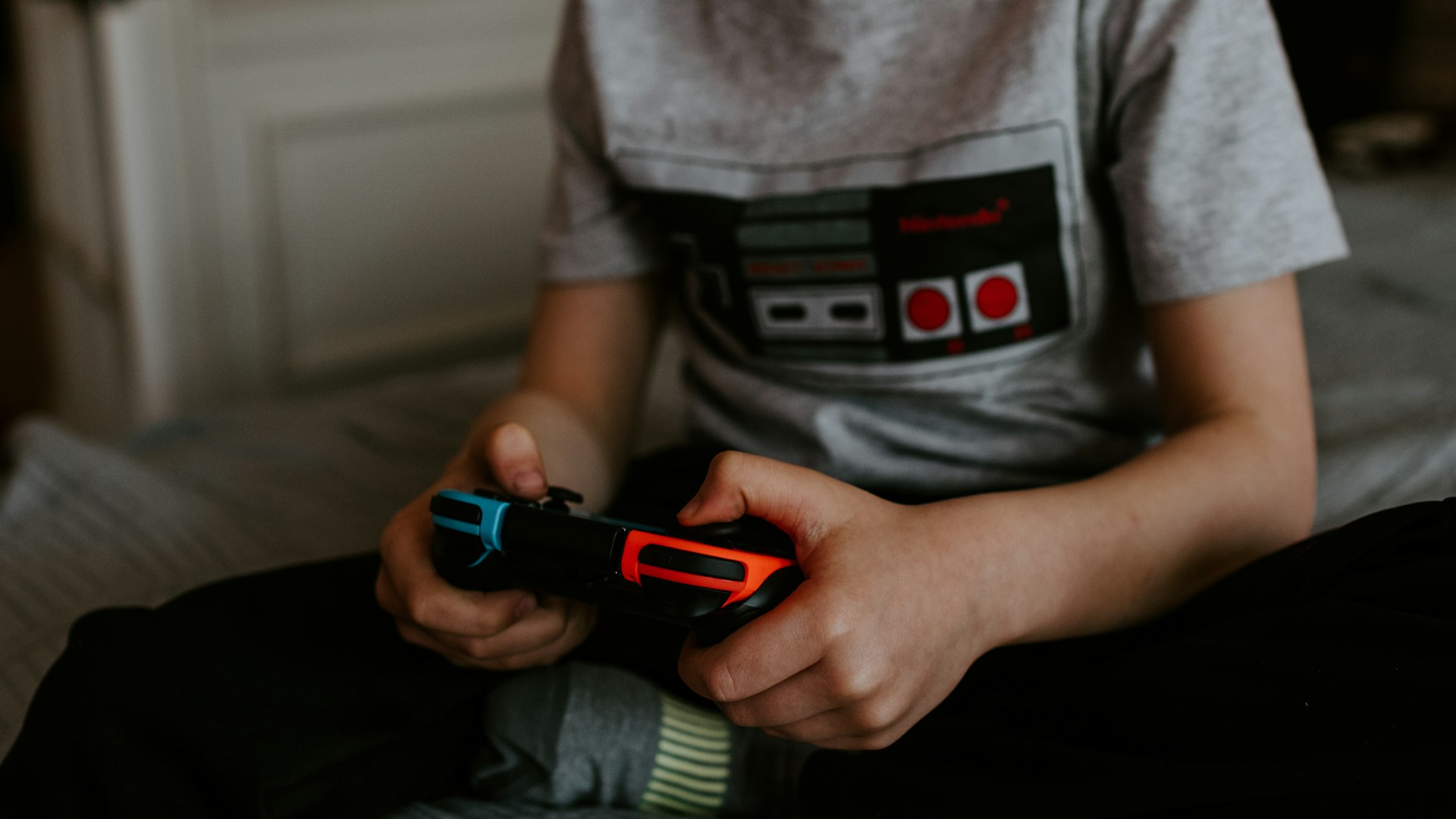 Competitive gamers at illuminated battle stations